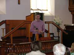 Dr Owain Edwards yn annerch